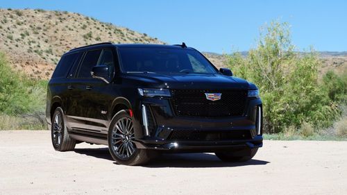 Black Cadillac Escalade luxury SUV